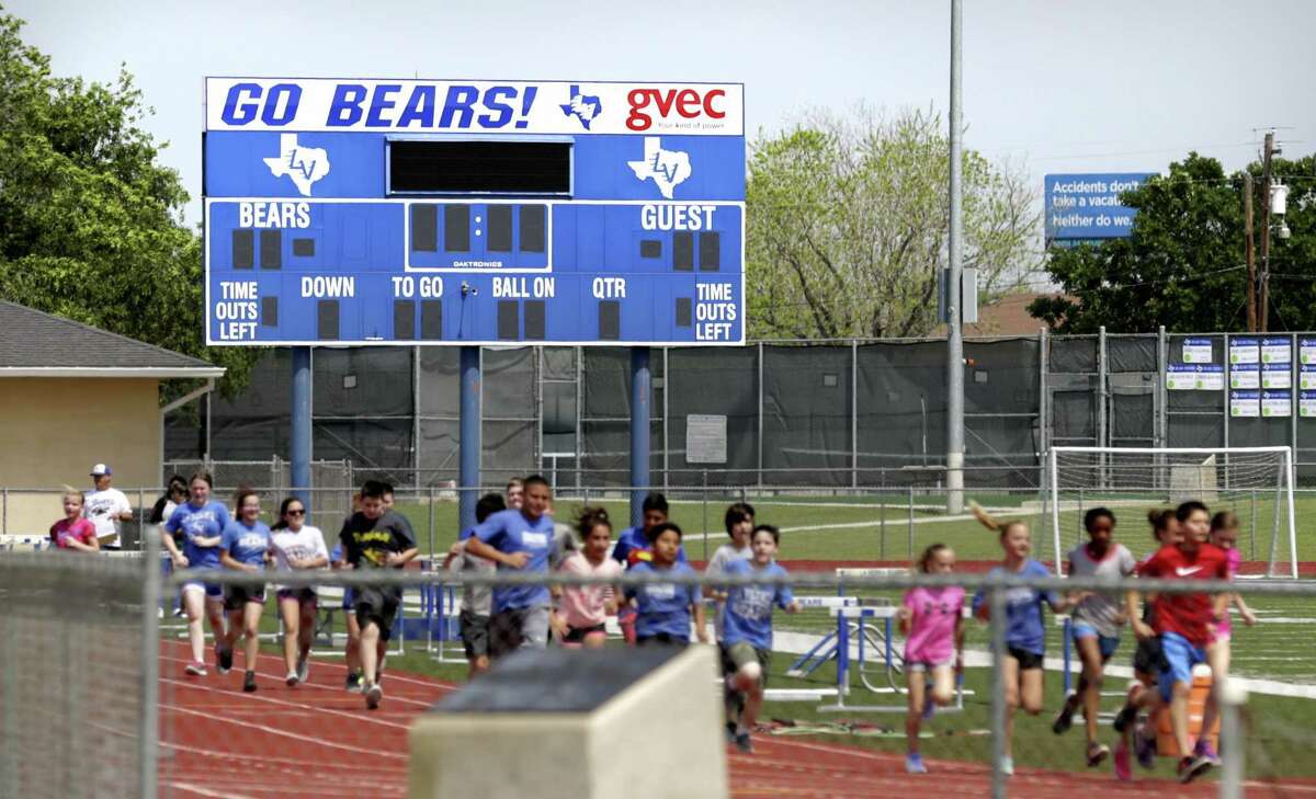 Students run on the track at La Vernia High School in La Vernia, TX, on Tuesday, March 28, 2017.