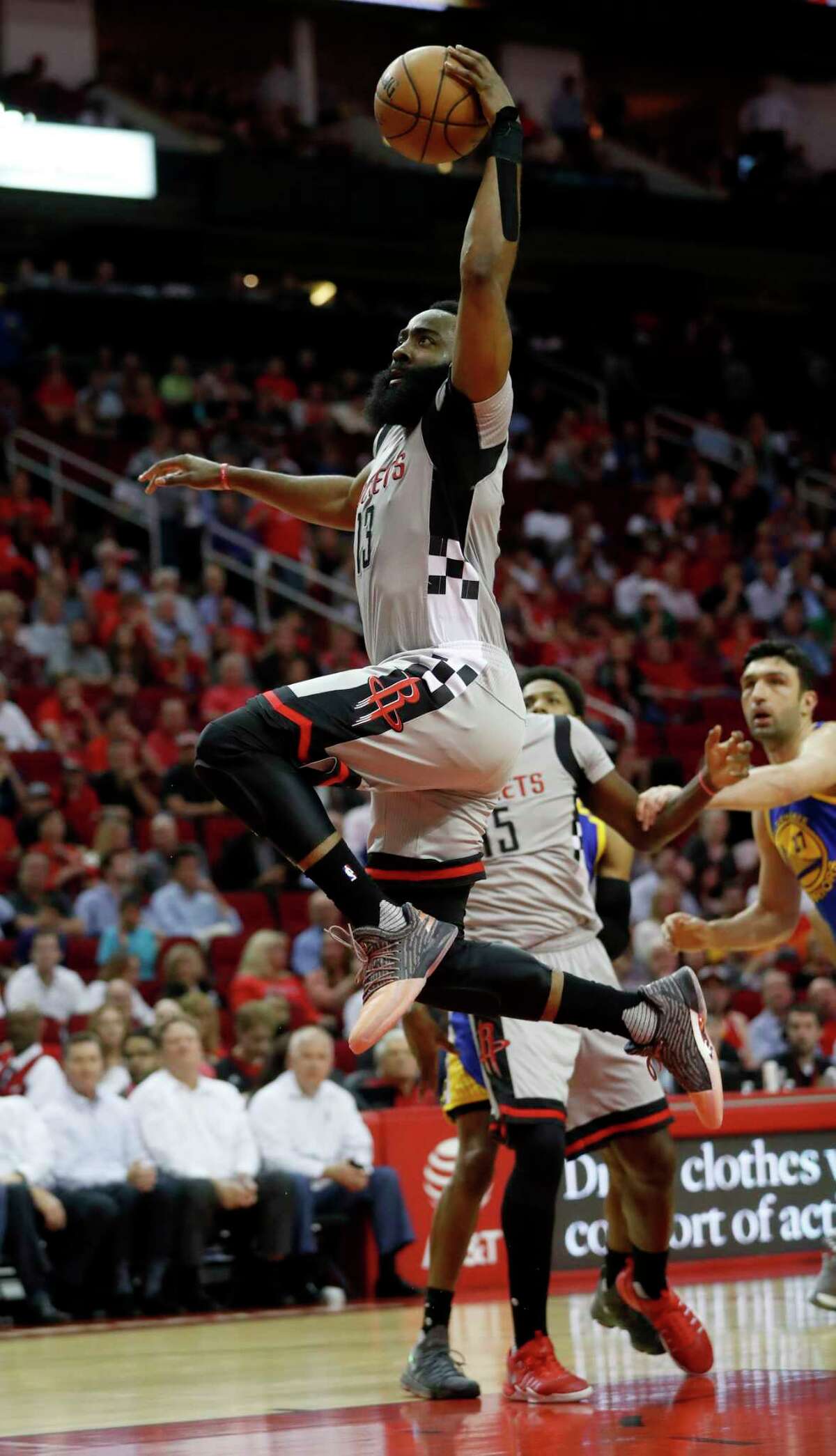 Houston Rockets guard James Harden (13) goes up for a basket attempt during the first half of an NBA basketball game at the Toyota Center, Tuesday, March 28, 2017, in Houston.