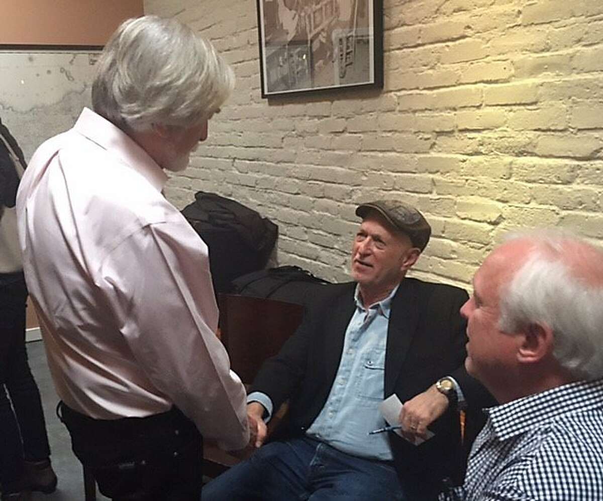 Bob Scheer talks to Dan Siegel and Stephen Talbot at fundraiser for documentary
