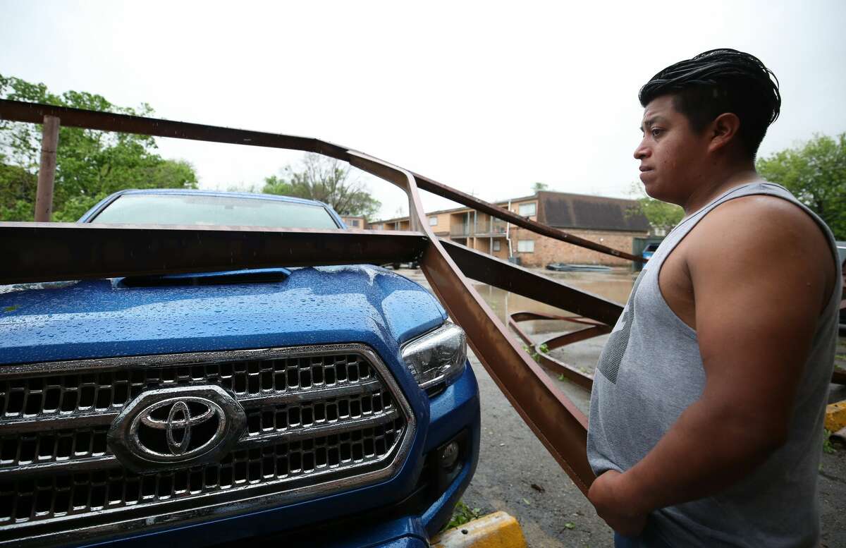 Sebastian Iguit looks at the damage left by the severe weather outside his residence at the 5900 Bissonnet Street apartment complex Wednesday, March 29, 2017, in Houston. ( Godofredo A. Vasquez / Houston Chronicle )