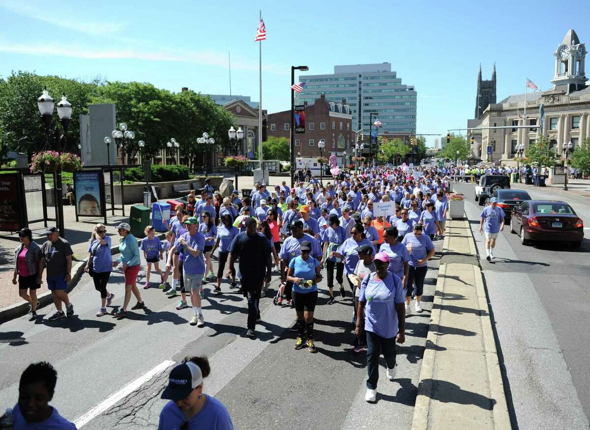 Folks flood the streets during a fund-raiser for CancerCare in Stamford in 2015. CancerCare will hold its fifth annual walk/run in Greenwich on Sunday.