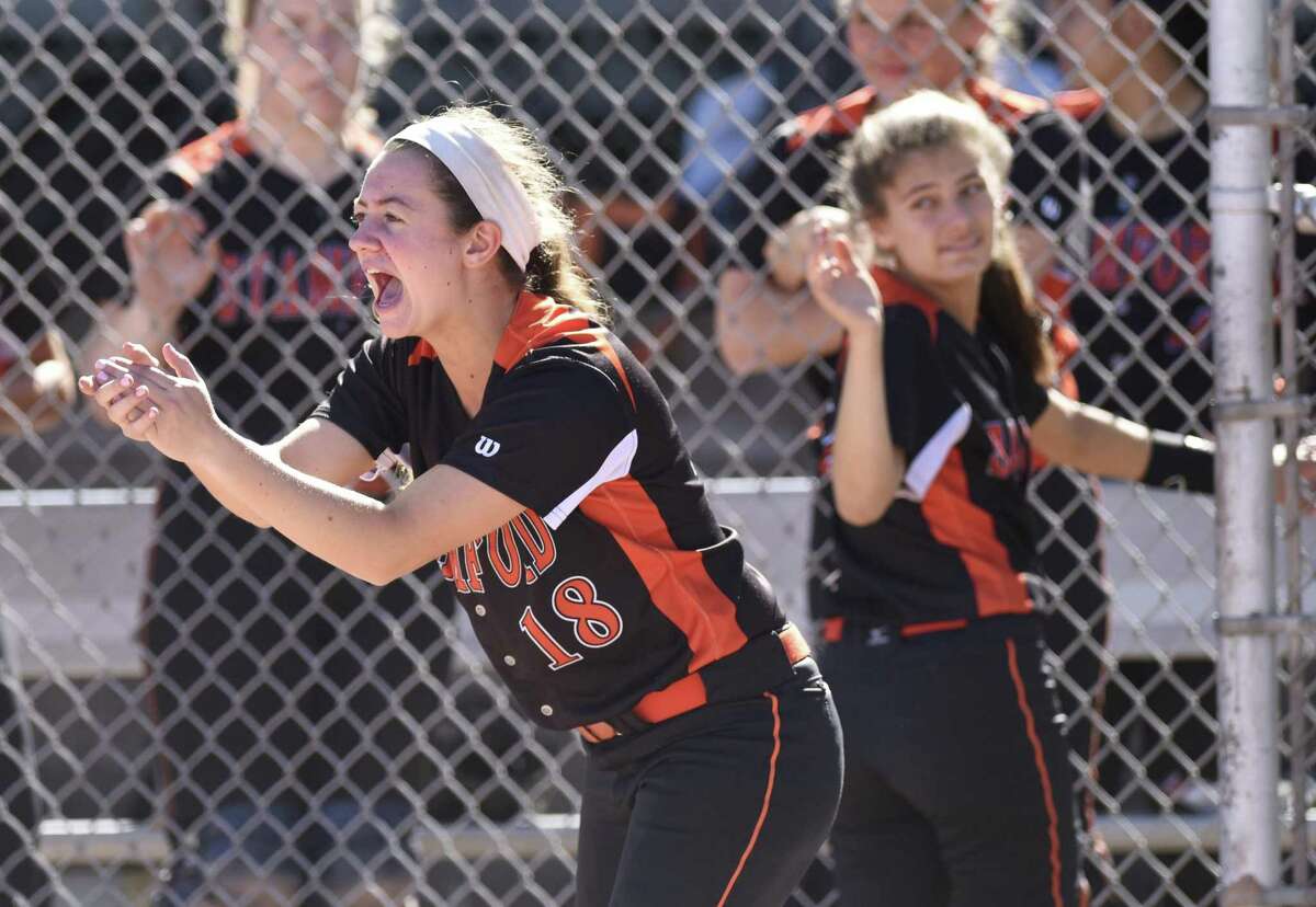 Stamford’s Lauren O’Neill (18) cheers after her team scored a run in Stamford’s 7-6 win over Fairfield Ludlowe in the high school softball game at Stamford High School in Stamford, Conn. Monday, May 16, 2016.