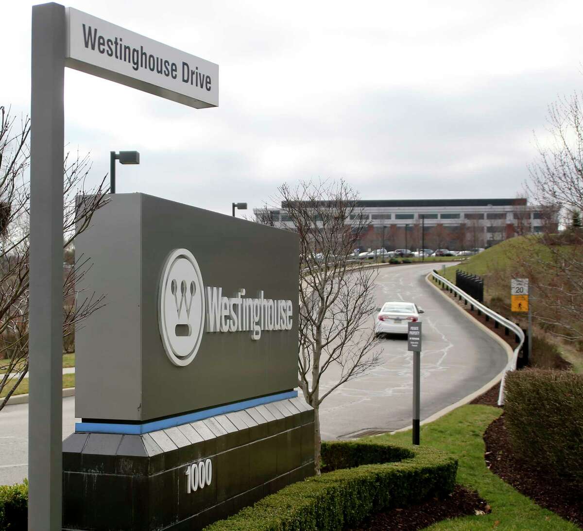 Vehicles move along the entrance to Westinghouse International Headquarters on Wednesday, March 29, 2017, in Cranberry, Pa., Butler county. Japan's embattled Toshiba Corp. says its U.S. nuclear unit Westinghouse Electric Co. has filed for bankruptcy protection, marking a key step in its struggles to stop the flow of massive red ink. (AP Photo/Keith Srakocic)