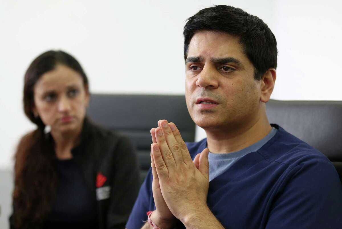 Doctors Pankaj Satija, right, and his wife Monika Ummat, left, talk to media about their immigration case at the Quan Law Group Thursday, March 30, 2017, in Houston. Satija and Ummat are facing possible immediate return to India.