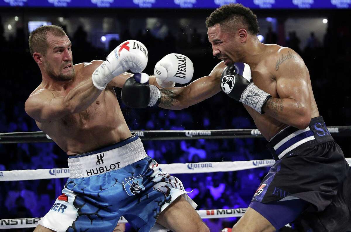 Sergey Kovalev (left) of Russia backs away from a punch from Andre Ward during a light heavyweight boxing match, on Nov. 19, 2016, in Las Vegas.