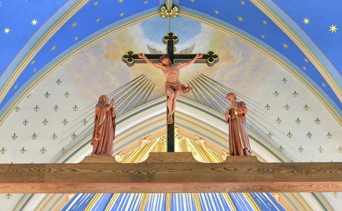 A unique feature is the Rood Beam with statues of Jesus, Mary and John high above the pews at St. Mary Roman Catholic Church on West Ave. in Norwalk Conn. on Thursday, March 30, 2017