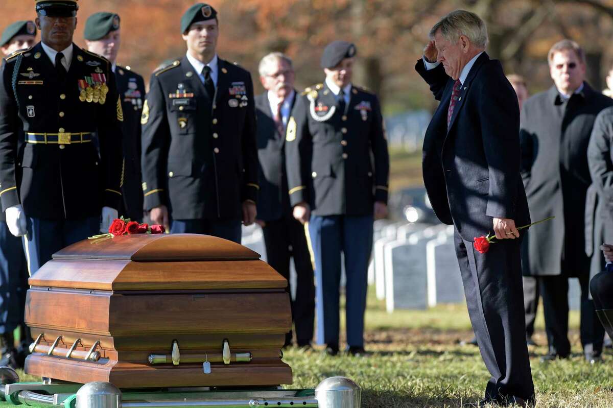 James Moriarty salutes the casket of his son, U.S. Army Staff Sgt. James F. Moriarty, ﻿at Arlington National Cemetery.﻿