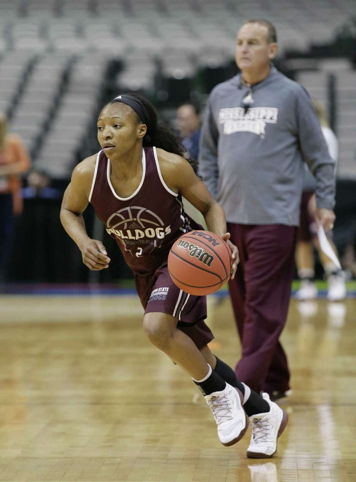 Mississippi State guard Morgan William drives to the basket under the watchful eye of coach Vic Schaefer on Thursday in Dallas.