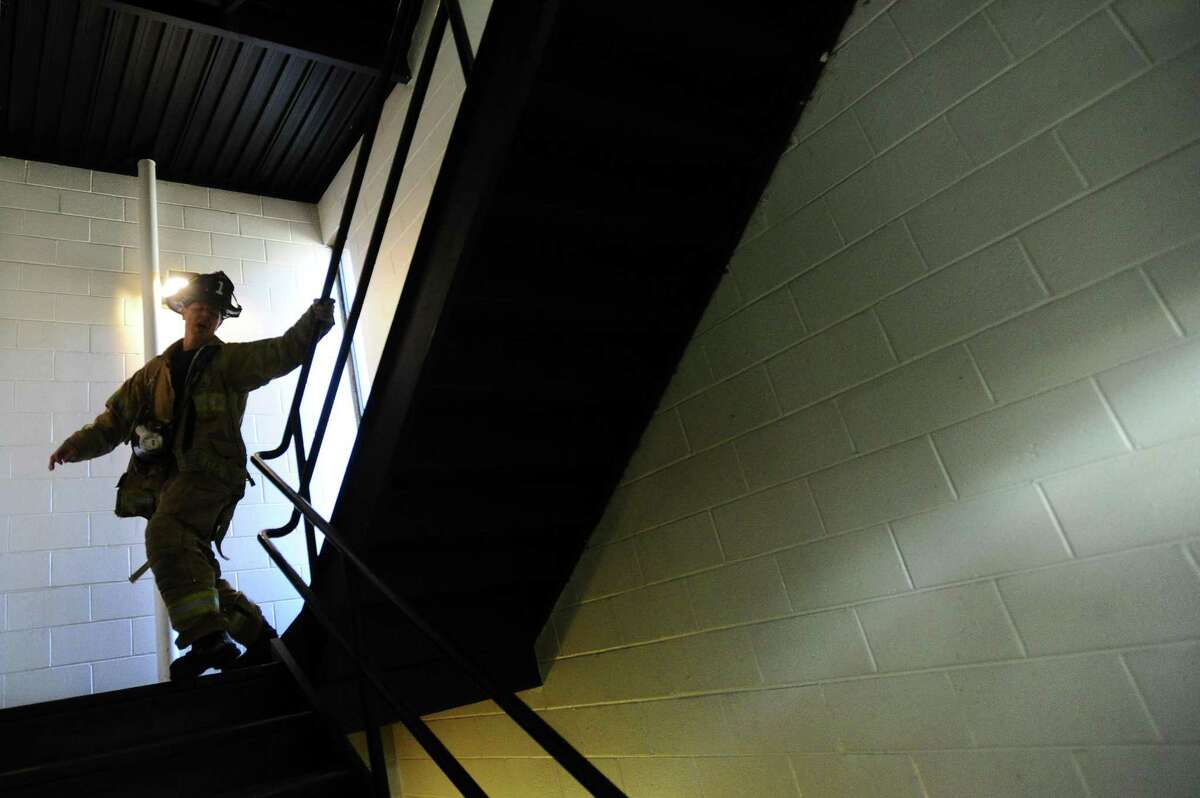 Stamford fire fighter Al Hagander runs up and down flights of stairs inside the Stamford Fire Station on E. Main St. in downtown Stamford, Conn. on Thursday, March 30, 2017. Hagander is training for the American Lung Association?’s annual New York City ?‘Fight for Air?’ Charity Stair Climb which requires fire fighters to climb 55 flights of stairs in full 50-pound gear.