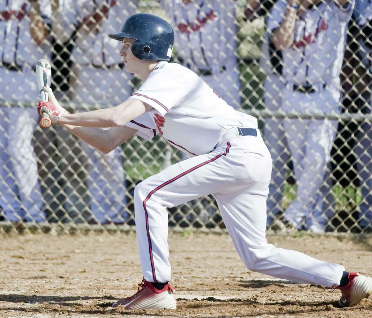 Griffin Root of Brien McMahon High School baseball lays down a bunt vs Staples High School in a game played at McMahon. Wednesday, April 27, 2016