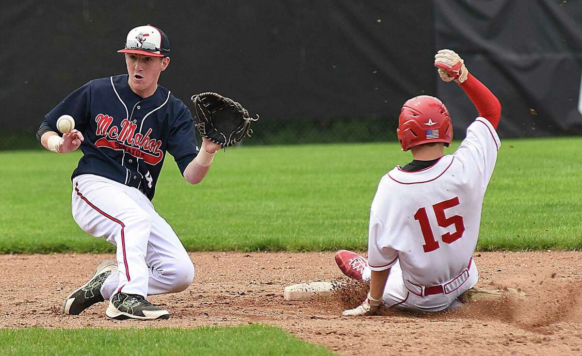 Brien McMahon shortstop Chris Giordano, left, waits for a late throw as Greenwich’s Ryan King safely steals second base an FCIAC baseball game in Greenwich. The host Cardinals won, 7-1, eliminating the Senators from league playoff contention. McMahon hopes to get back to the playoffs this season on a brand new field still under construction.