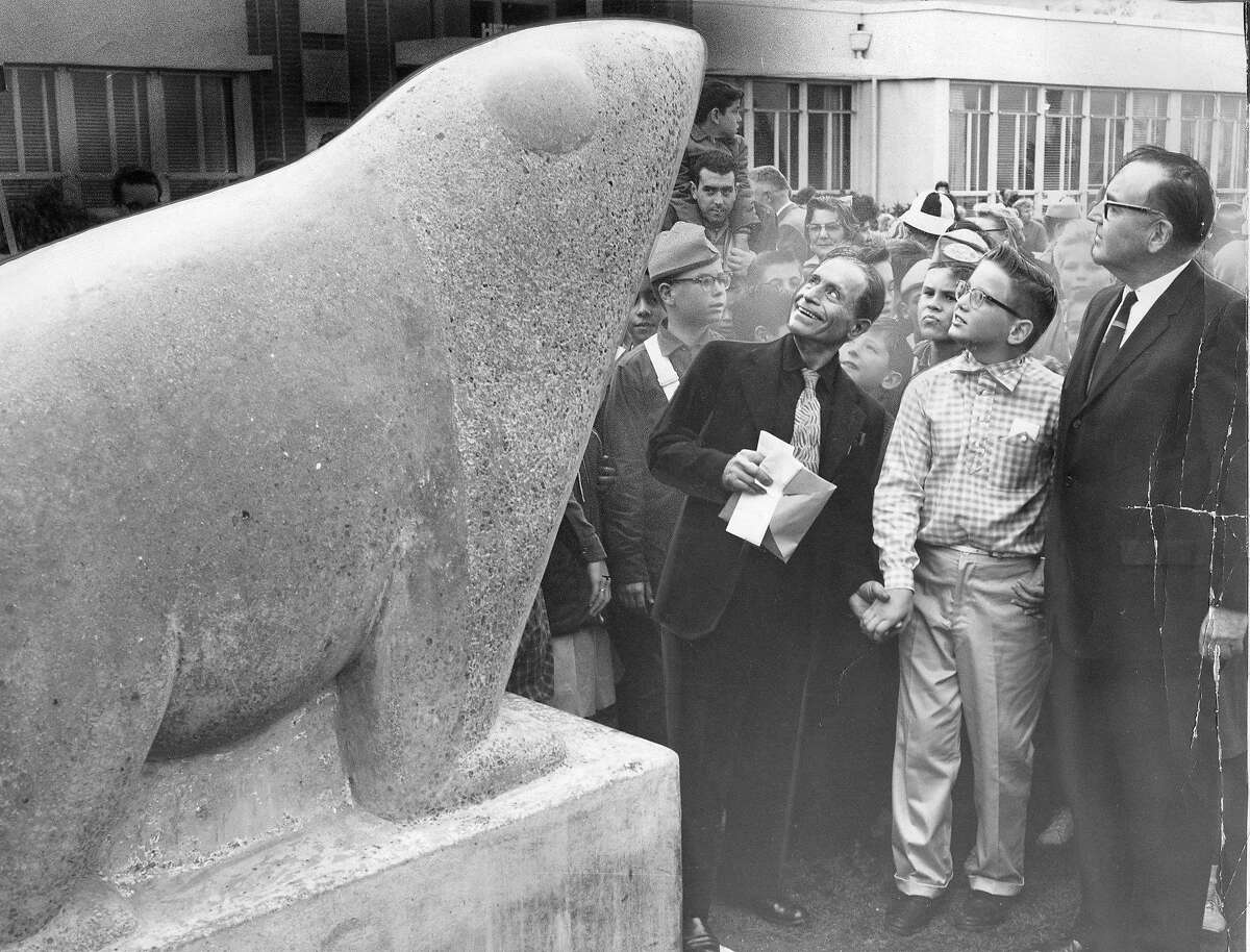 Benny Bufano, Billy McGee and Governor Edmund G. Brown (r) and children at the Pittsburg Heights Elementary School admire the Benny Bufano statue Photo ran November 4, 1960-, p. 5