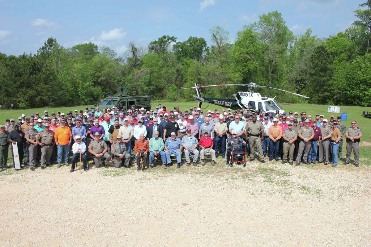 Active and retired members of the Texas Department of Public Safety, including highway patrol and Texas Rangers, gather for a group photo at the Region 2 Fifth Annual FQ and Luncheon at the Liberty County Firearms Range near Cleveland on March 28.