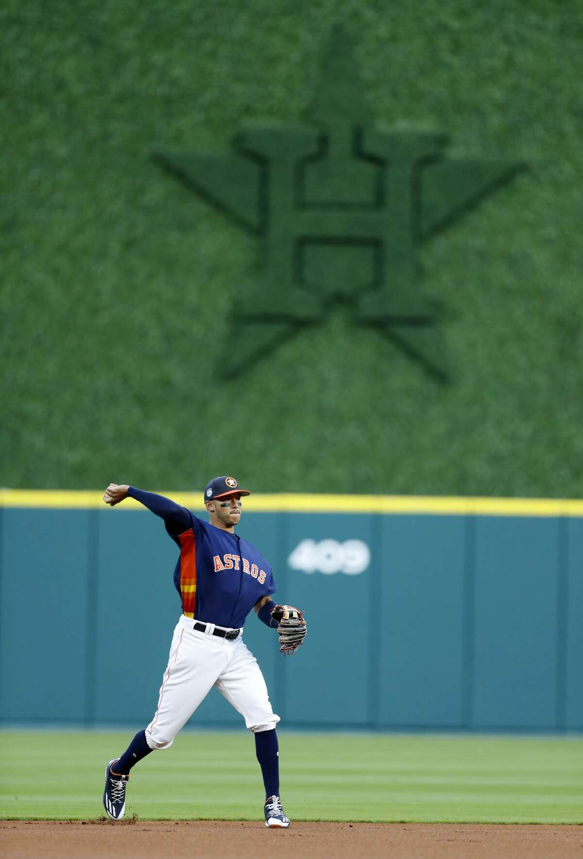 Houston Astros shortstop Carlos Correa (1) warms up with the new batter's eye in the background during the first inning of an MLB exhibition game at Minute Maid Park, Thursday, March 30, 2017, in Houston. ( Karen Warren / Houston Chronicle )