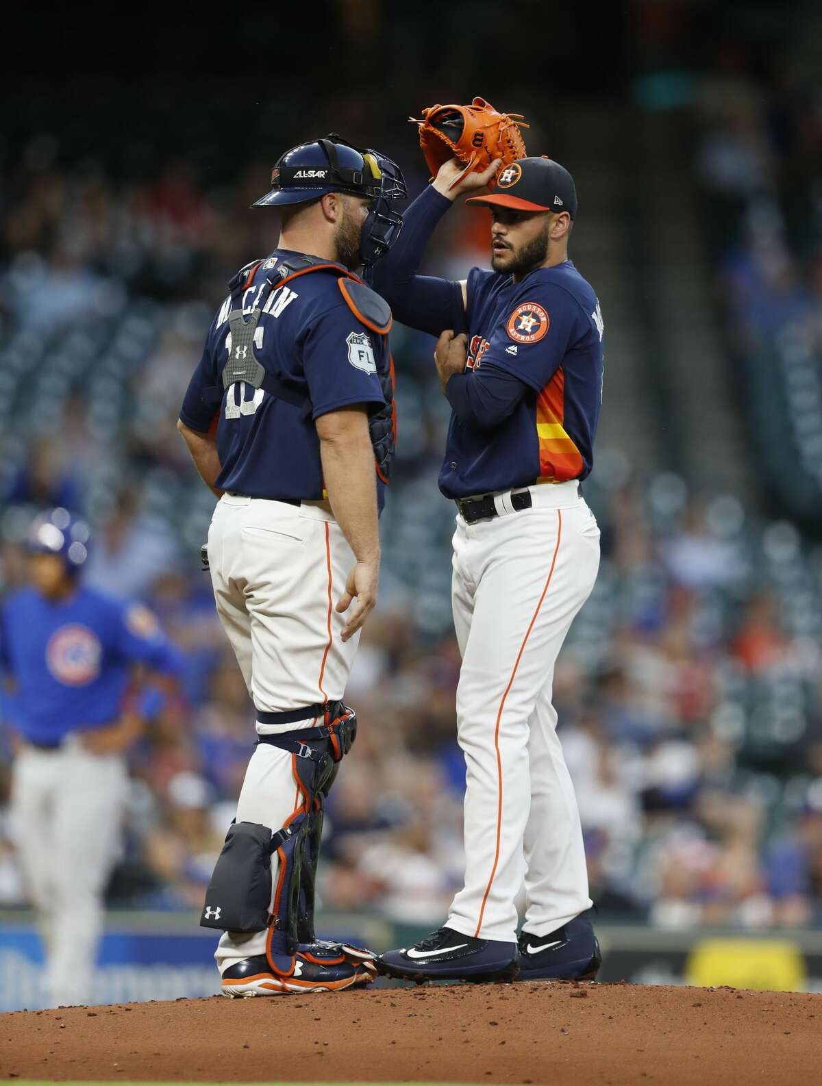 Houston Astros starting pitcher Lance McCullers Jr. (43) reacts with catcher Brian McCann (16) after giving up a run during the second inning of an MLB exhibition game at Minute Maid Park, Thursday, March 30, 2017, in Houston. ( Karen Warren / Houston Chronicle )