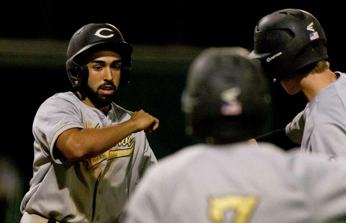 Justin Perez #14 of Conroe celebrates after hitting a solo home run off Montgomery pitcher Dillon Smith (10) to give the Tigers a 3-2 lead during the seventh inning of a District 12-6A high school baseball game at Montgomery Athletic Complex on Thursday, March 30, 2017, in Montgomery.