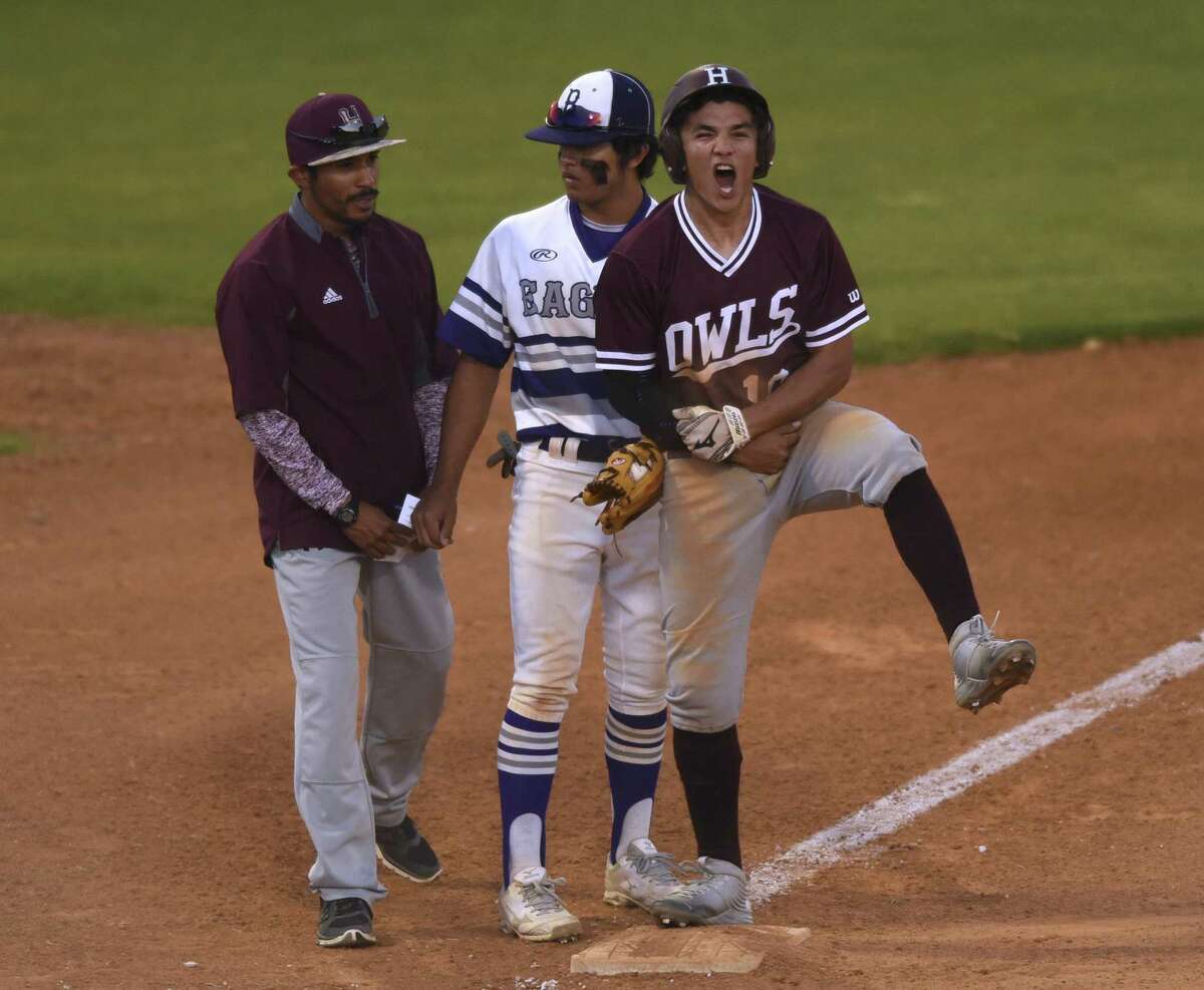 Highlands’ John Cruz (right) celebrates after hitting a first-inning RBI triple against Brackenridge during a District 28-5A game at the SAISD Complex on March 30, 20l17. Brackenridge third baseman Johnathon Lucas (center) and Harlandale coach Stephen Jauregui stand by.