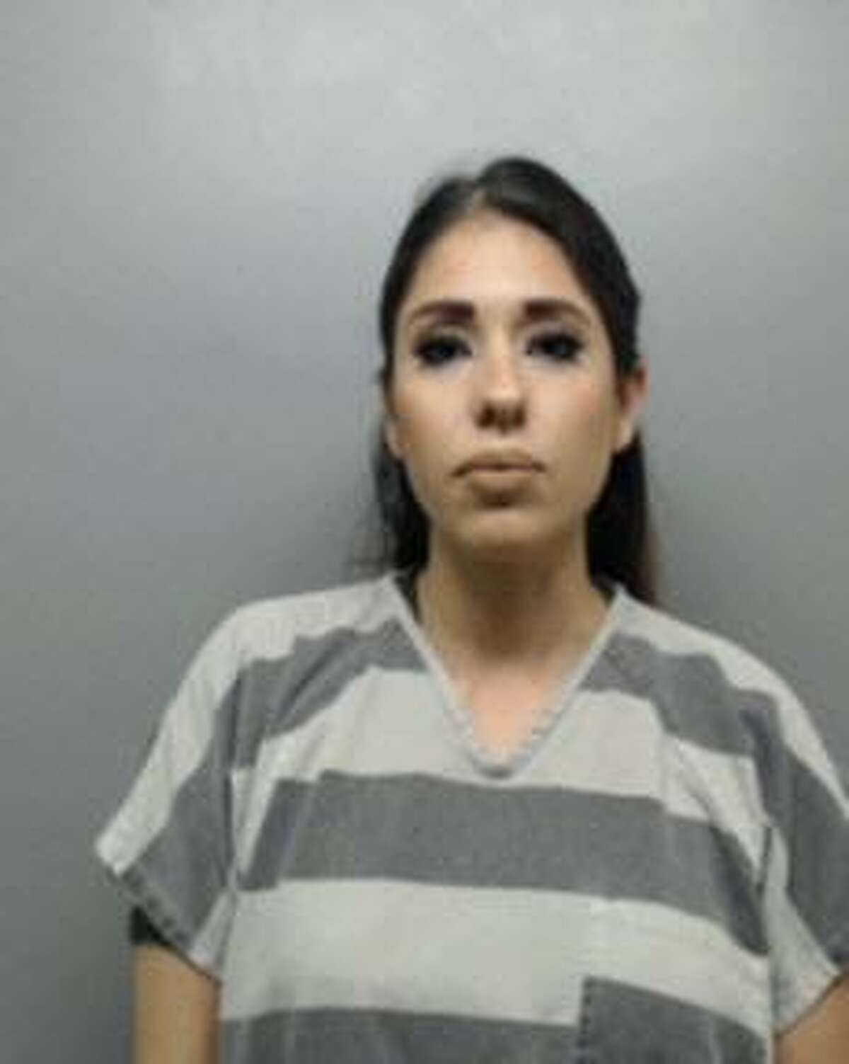 Karla Alvarez is pictured. Keep clicking through to see a gallery of people who smiled in their mugshots.
