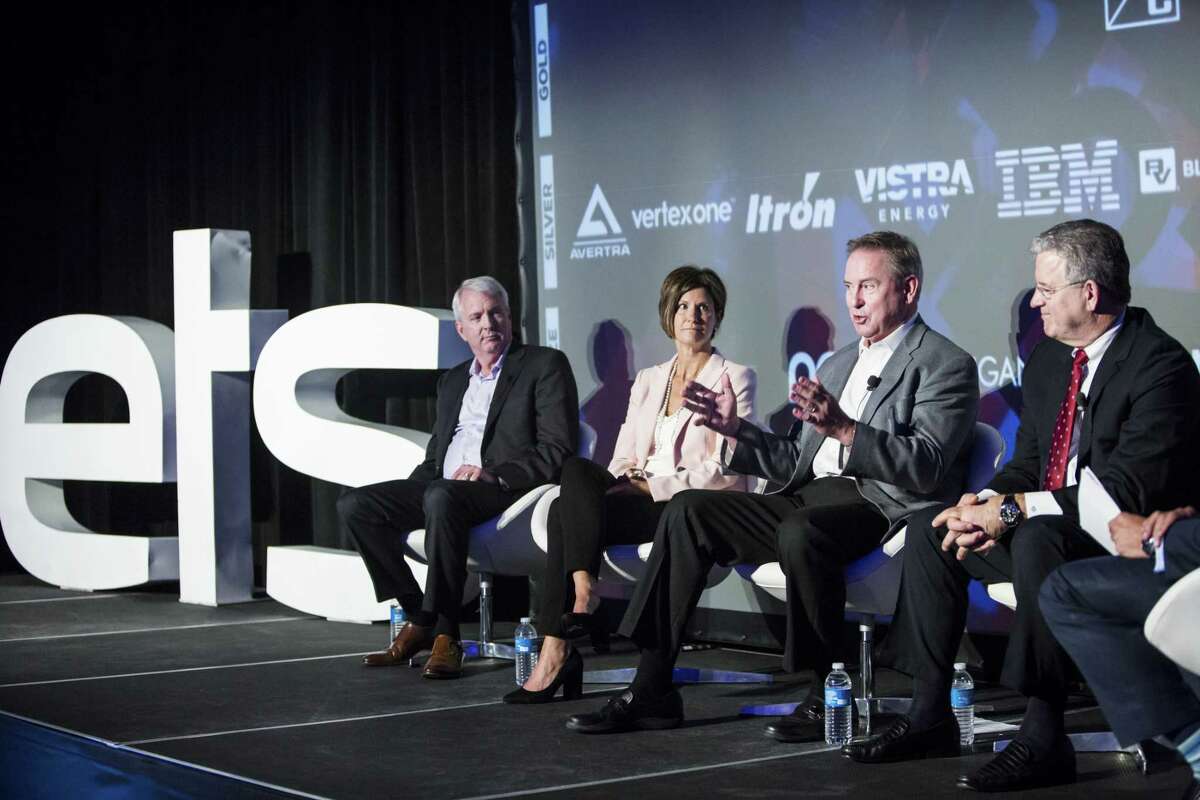 Ben Fowke, president and chief executive officer of Xcel Energy Inc., from left, Mary Powell, president and chief executive officer of Green Mountain Power Corp., Larry Weis, chief executive officer of Seattle City Light, and Rodger Smith, senior vice president and general manager of Oracle Corp., participate in a panel discussion at the ETS17 conference in Austin, Texas, U.S., on Wednesday, March 29, 2017. ETS17 calls all creative minds to convene and design real solutions for the energy transformation taking place today. Photographer: Matthew Busch/Bloomberg