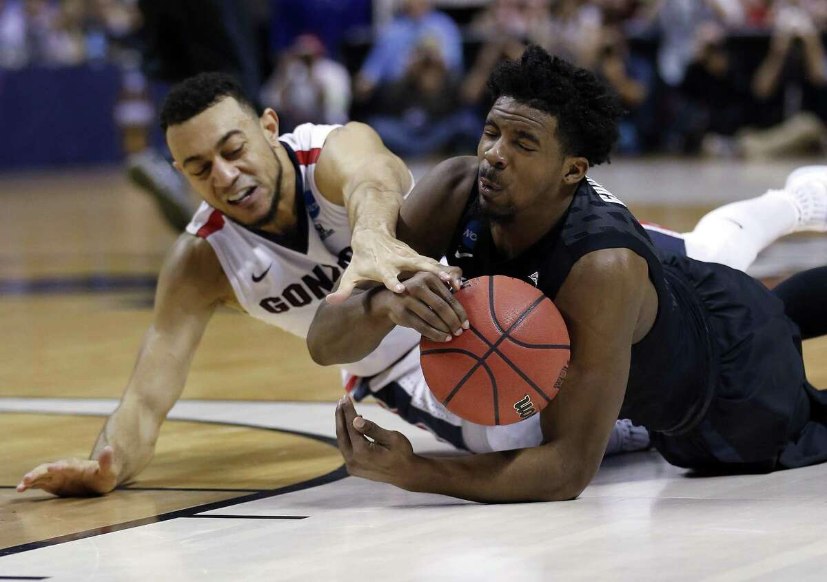 Xavier guard Quentin Goodin (righ) grabs a loose ball next to Gonzaga guard Nigel Williams-Goss during the first half of an NCAA Tournament game on March 25, 2017, in San Jose, Calif.
