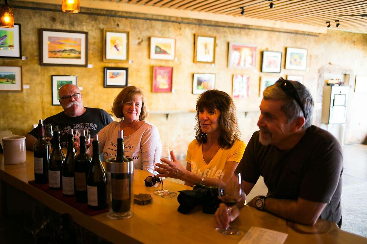 From the far left, Chris Kelley and Donna Kuckhoff of Reno with Ellie Brown and Dean Brown of Susanville enjoy their wines at the Fore Family Vineyards Wine Room in Kelseyville.