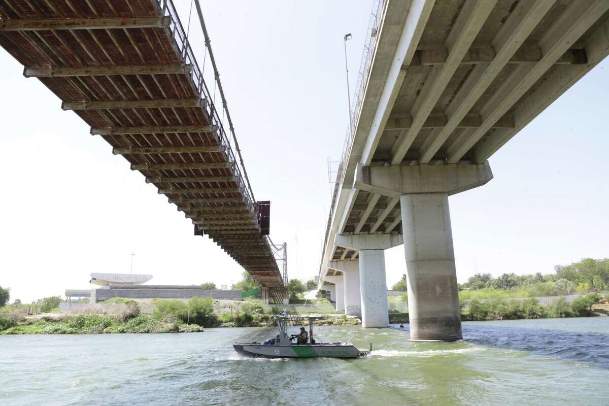 A Border Patrol boat travels east on the Rio Grande River under the old historic bridge I n Roma, TX on Thursday, March 23, 2017. Assaults to Customs Border Protection Agents, especially to the boat patrol crews have increased.