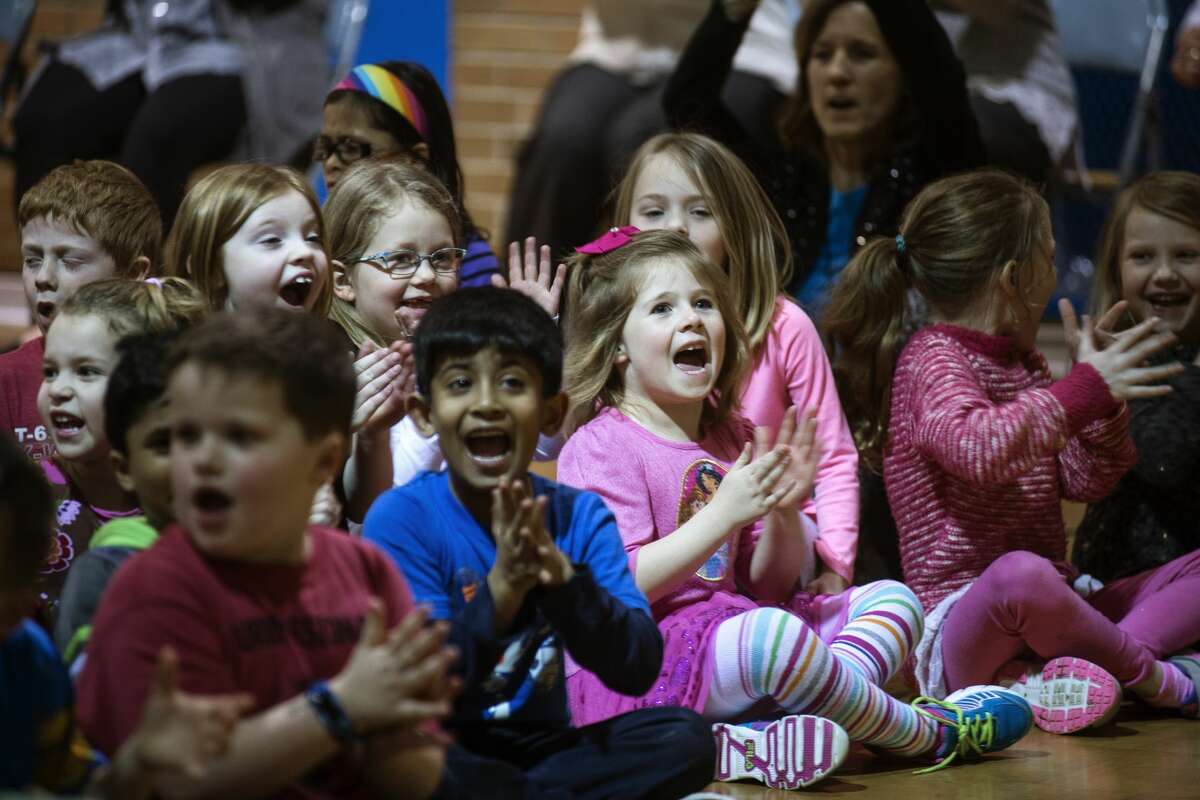 ERIN KIRKLAND | ekirkland@mdn.net Kindergarteners clap after hearing that they've won the lower-level competition for collecting the most socks on Tuesday at Chestnut Hill Elementary. Winning classes received a Wendy's kids meal. The school collected 671 pairs of socks for SNEAKERPALOOZA, which Kurt Faust, president and founder of STEP UP and SNEAKERPALOOZA organizer, collected at the gym. "The kids wanted to take action and liked what SNEAKERPALOOZA was doing in the community," Chestnut Hill media center paraprofessional Becky Tomaszewski said. SNEAKERPALOOZA is joint effort between Success Through Education and Positive Coaching (STEP UP), Filling Midland?•s Cup, and other local churches and organizations which provides new, name-brand athletic shoes to area students. Last year, SNEAKERPALOOZA distributed over 1600 pairs of shoes to K-12 students in the area.