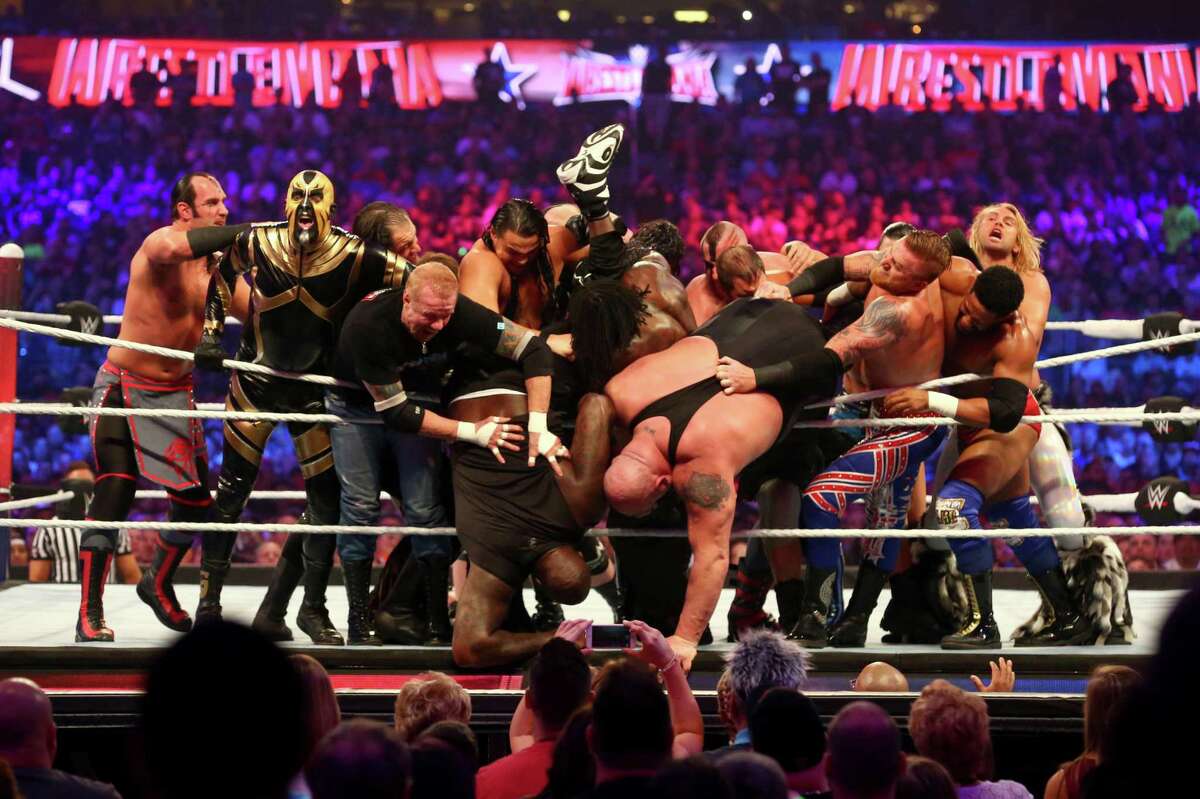 Shaquille O'Neal and Big Show are thrown from the ring during the Andre the Giant Memorial Battle Royal at Wrestlemania 32 at AT&T Stadium in Arlington, Texas, Sunday, April 3, 2016. (Richard W. Rodriguez/Star-Telegram via AP)