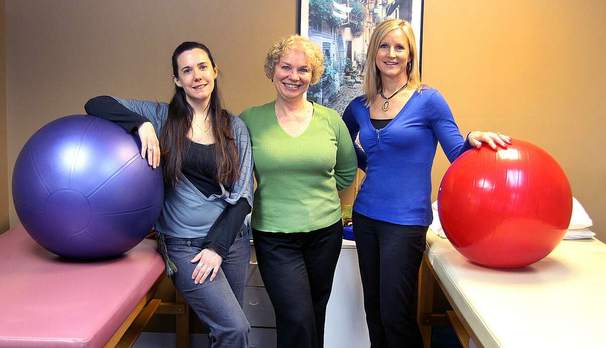 Caitlin deDufour, Karen Schwarzchild and Christine Bray of  Physical Therapy Arts stand in the physical therapy room of their New Fairfieid, Conn., location on Friday, March 31, 2017.