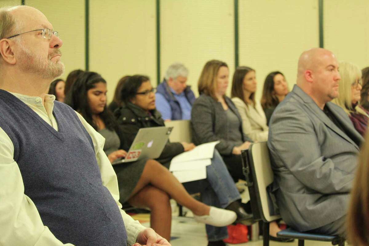 Members of the school community, concerned about the school budget reductions, watch the discussion at the March 27, 2017 Board of Education meeting.