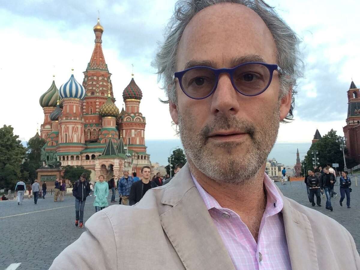 Author Amor Towles in Moscow’s Red Square with St. Basil’s Cathedral in the background.