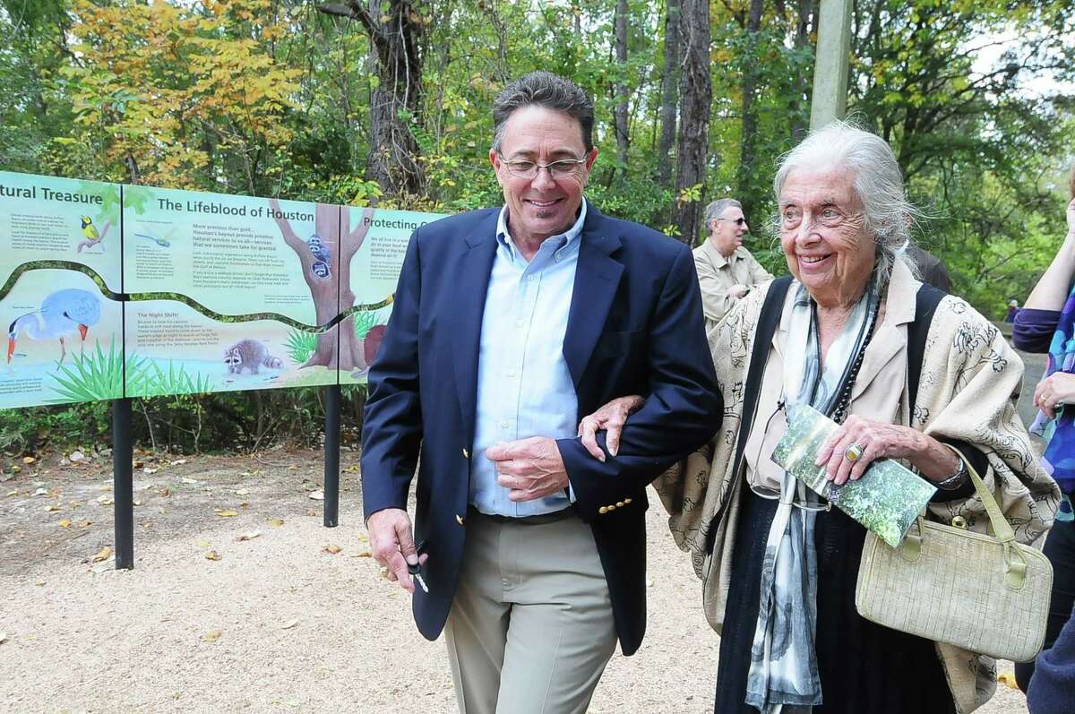 Robert Rayburn (President of the Bayou Preservation Association and Energy Corridor District landscape architect) accompanies Terry Hershey after the dedication of a new bayou educational display in Terry Hershey Park Wednesday 11/20/13.