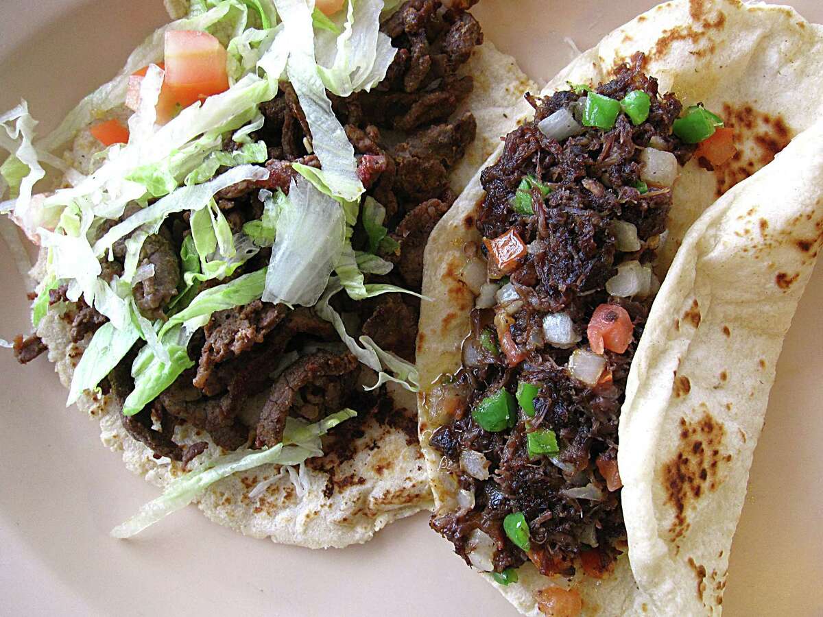 Carne asada, left, and barbacoa a la mexicana tacos on handmade tortillas from 4 Missions Cafe.