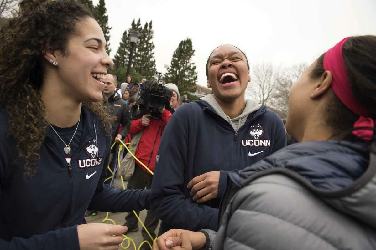 UConn’s Kia Nurse, Azura Stevens and Napheesa Collier share a laugh outside Gampel Pavilion in Storrs on Tuesday as they prepare to board a bus to depart for the Final Four in Dallas. Stevens, a 6-foot-6 transfer from Duke, will be eligible to play for the Huskies next season.