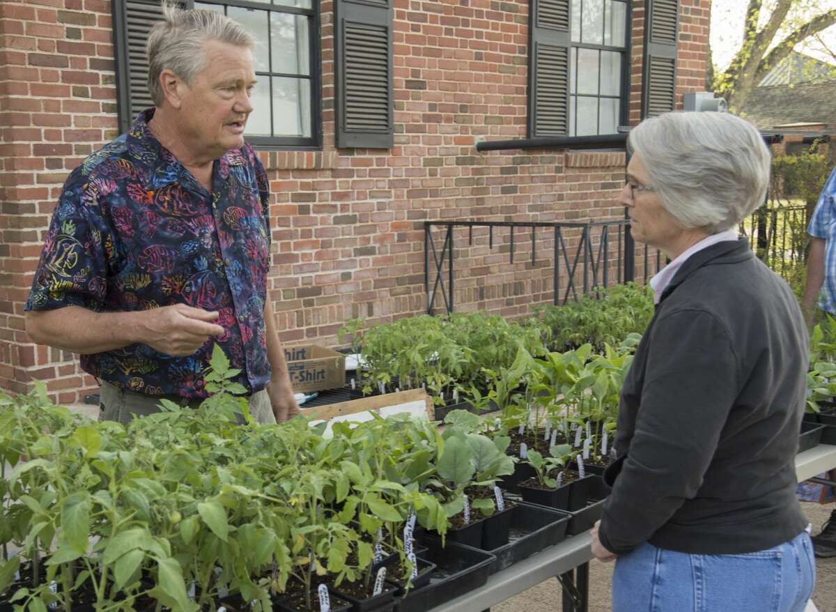 Bill Rutter talks with a customer about his vegtable plants 04-01-17 at the opening day of Midland Farmers Market on the ground of the Museum of the Southwest. Tim Fischer/Reporter-Telegram