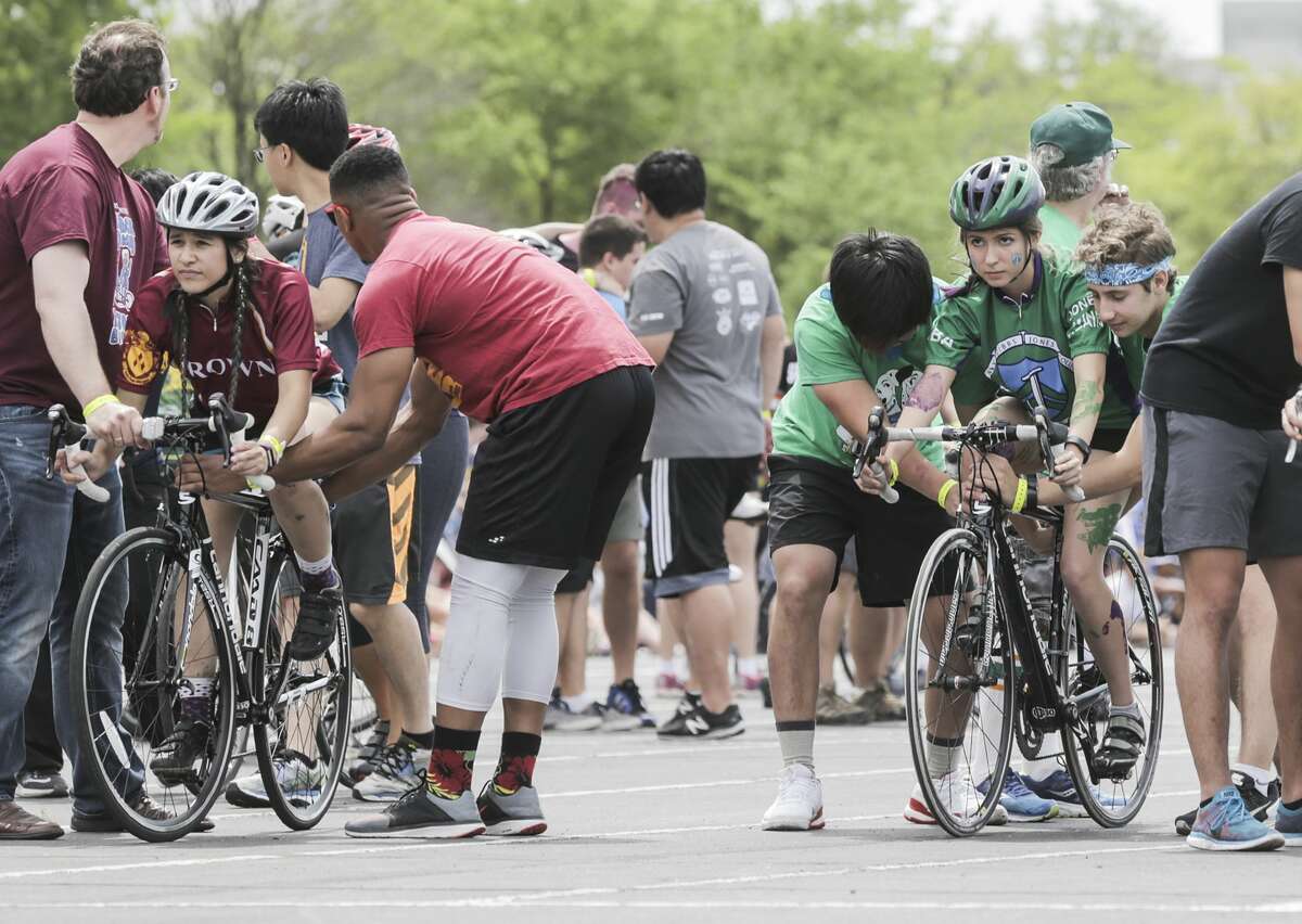 Female cyclists prepare to compete in Rice University's 60th Annual Beer Bike competition on Saturday, April 1, 2017, in Houston. ( Elizabeth Conley / Houston Chronicle )