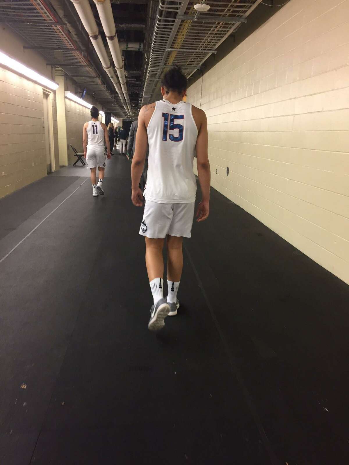 UConn women's basketball player Gabby Williams walks to the team's locker room Friday night after the Huskies lost to Mississippi State, 66-64, at the Final Four in Dallas.