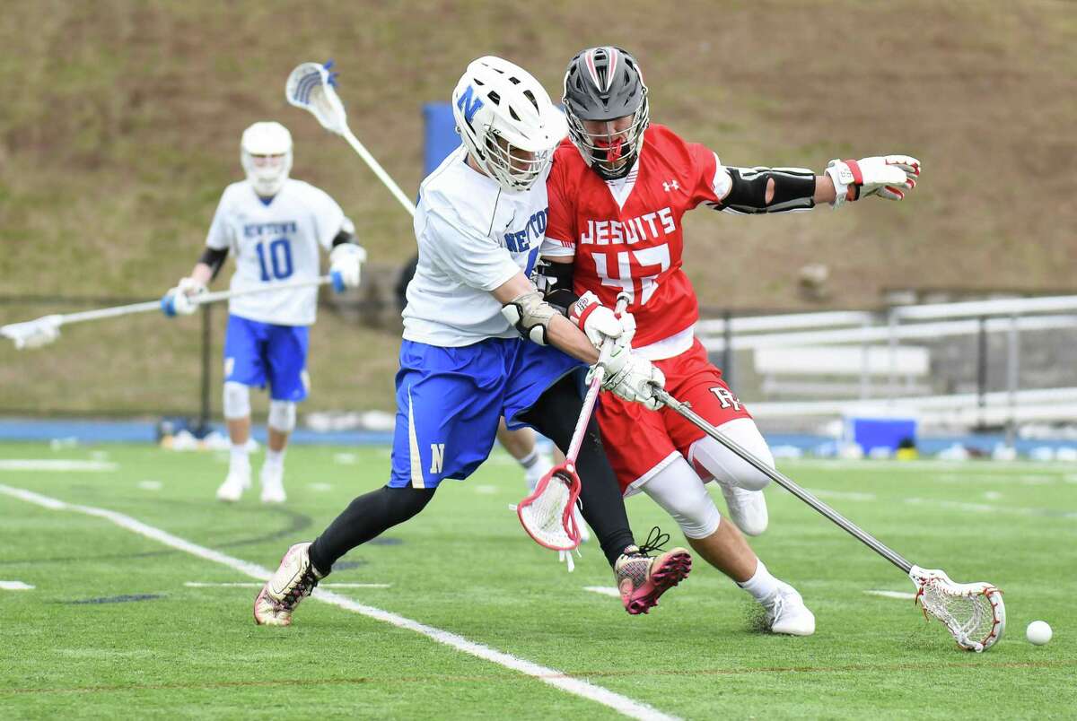 Game action between the Fairfield Prep Jesuits and the Newtown Night Hawks at Newtown High School on April 1, 2017 in Newtown, Connecticut.
