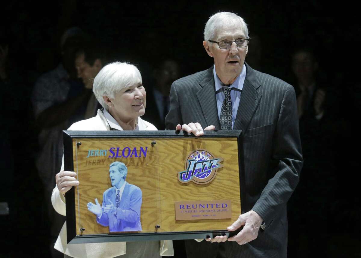 Utah Jazz owner Gail Miller and former coach Jerry Sloan pose for a photograph during a 20-year reunion ceremony for the basketball team that reached the 1997 NBA Finals, at halftime of the Jazz's game against the New York Knicks on Wednesday, March 22, 2017, in Salt Lake City. (AP Photo/Rick Bowmer, Pool)