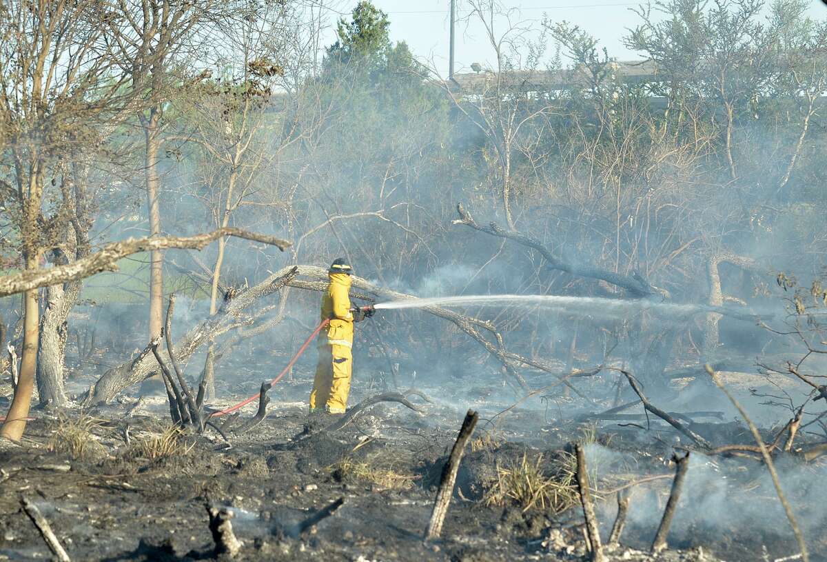 Laredo Fire Department firefighter can be seen within the property of North Central Park, Thursday, March 30, 2017.