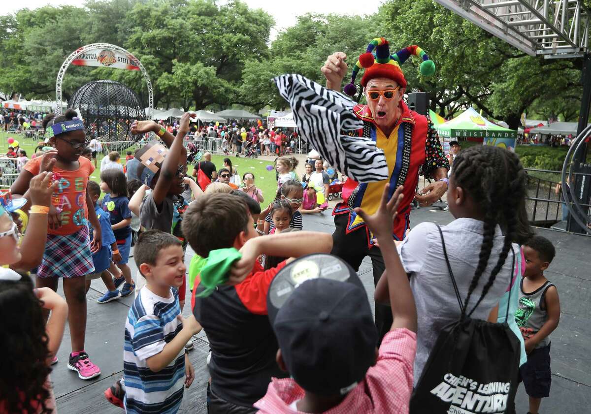 Children were entertained on stage by jester Claude Sims at The McDonald's Houston Children's Festival Saturday, April 1, 2017, in Houston. The event is the largest children's festival in the United States. Two days of games, circus acts, rides, food, beverages, and entertainment for all ages centered in downtown Houston.