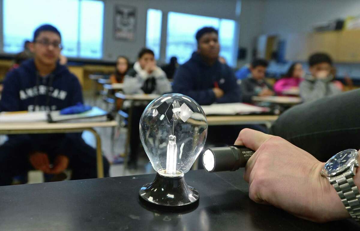 Brien McMahon High School environmental science teacher Mark Linsky, teaches his Freshman Physical Science class about energy transference using a radiometer Friday. March 31, 2017, at the school in Norwalk, Conn. A recent survey showed that 70 percent of Americans believe that climate change is occuring, but only 53 percent of those polled believe that it is anthropogenic or man-made.