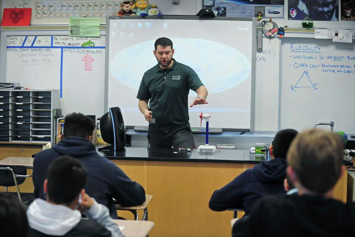 Brien McMahon High School environmental science teacher Mark Linsky, teaches his Freshman Physical Science class about energy transference using a wind turbine Friday. March 31, 2017, at the school in Norwalk, Conn. A recent survey showed that 70 percent of Americans believe that climate change is occuring, but only 53 percent of those polled believe that it is anthropogenic or man-made.