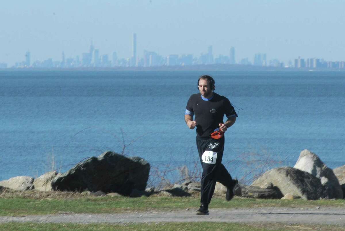 Hank Fatigate runs in the CancerCare Walk/Run for Hope 5K at Greenwich Point Park in Old Greenwich, Conn. Sunday, April 2, 2017. Hundreds of participants traversed the shoreline at Tod's Point on a sunny day to raise money for CancerCare, which provides free professional services to anyone affected by cancer.