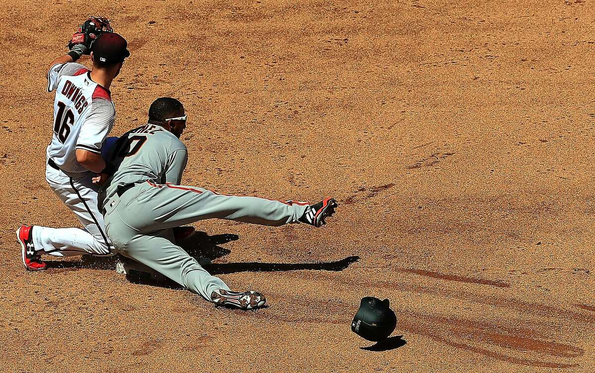PHOENIX, AZ - APRIL 02: Eduardo Nunez #10 of the San Francisco Giants steals second base against Chris Owings #16 of the Arizona Diamondbacks in the second inning during MLB Opening Day 2017 at Chase Field on April 2, 2017 in Phoenix, Arizona. (Photo by Ronald Martinez/Getty Images)