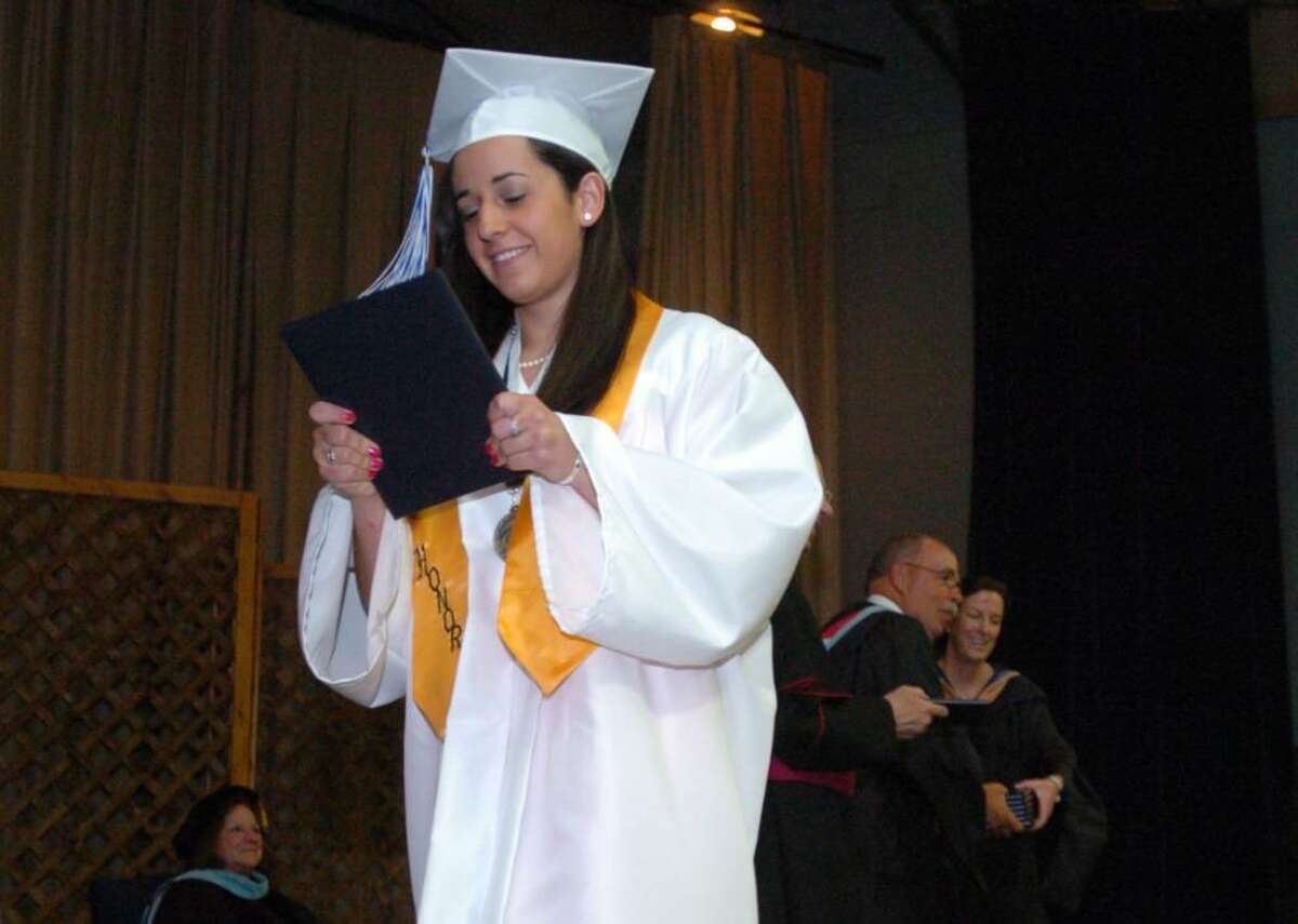 Emily DaSilva, 17, walks off stage during Immaculate High School graduation Wednesday, June 2, 2010.