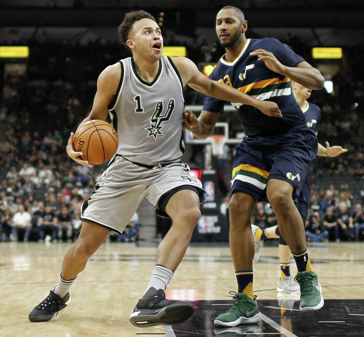 Spurs’ Kyle Anderson looks for room around the Utah Jazz’s Boris Diaw during second half action on April 2, 2017 at the AT&T Center.