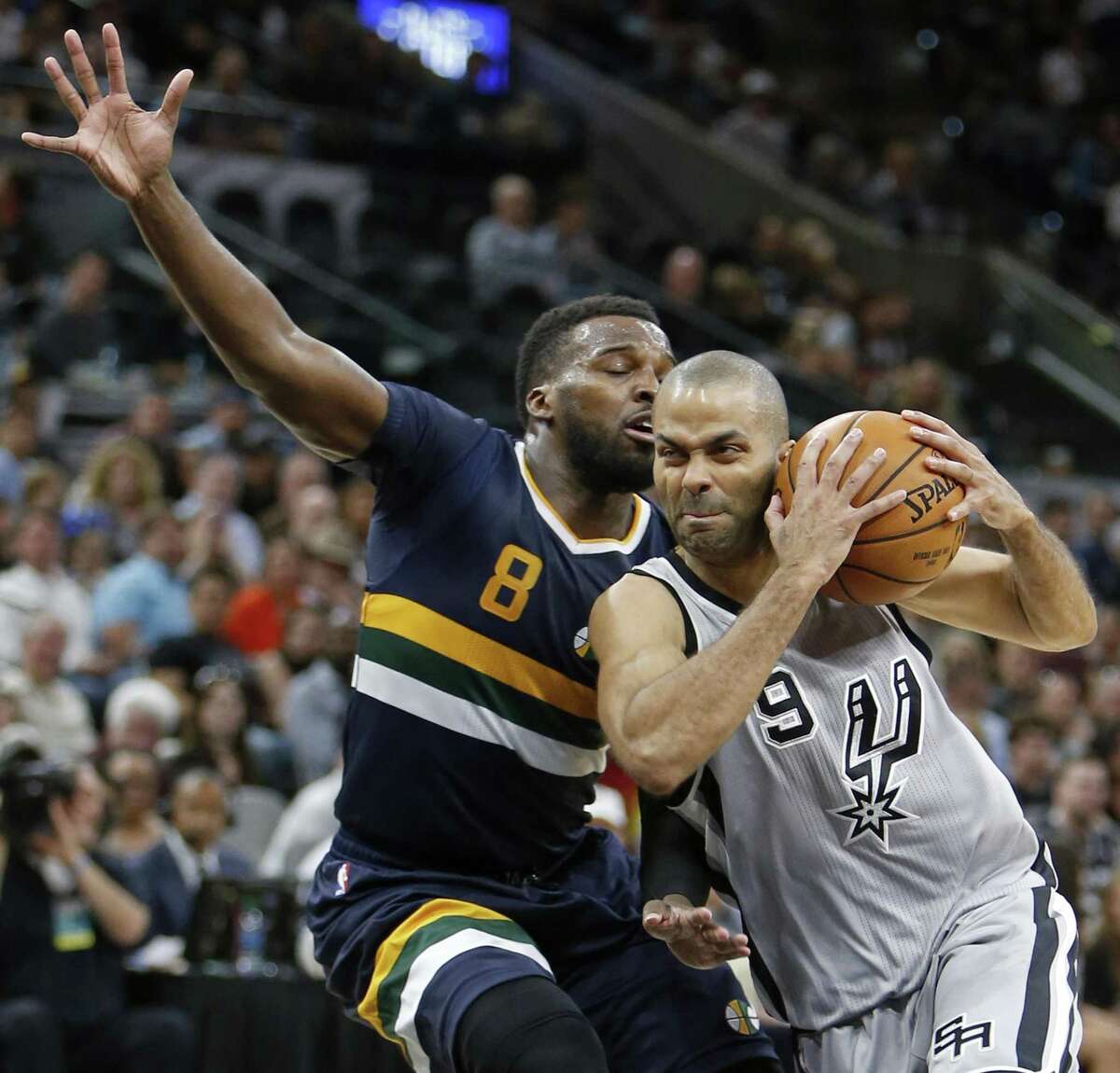 Spurs’ Tony Parker looks for room around the Utah Jazz’s Shelvin Mack during their game April 2, 2017 at the AT&T Center.