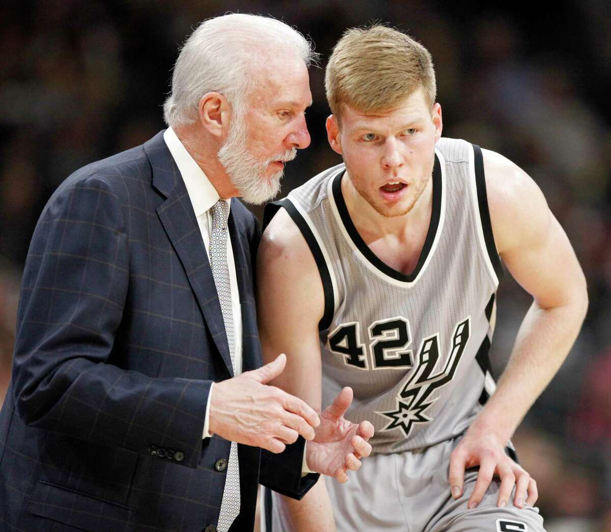 San Antonio Spurs head coach Gregg Popovich talks with Davis Bertans during second half action against the Utah Jazz Sunday April 2, 2017 at the AT&T Center. The Spurs won 109-103.