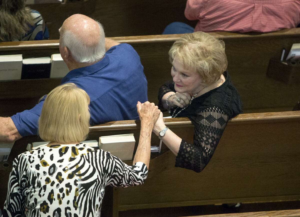 Congregants comfort one another as they grieve the loss of thirteen parishioners on Sunday, April 2, 2017, at First Baptist Church in New Braunfels. (Laura McKenzie | Herald-Zeitung)